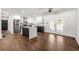 Bright, open kitchen with hardwood floors, modern stainless steel appliances and a center island at 4158 Pepperdine Dr, Decatur, GA 30034