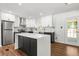 Modern kitchen with marble countertops, stainless steel appliances, and a center island at 4158 Pepperdine Dr, Decatur, GA 30034