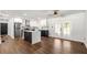 Open concept kitchen featuring black and white cabinets, island, and stainless steel appliances at 4158 Pepperdine Dr, Decatur, GA 30034