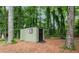 Exterior shot of outbuilding/shed with a single window and door surrounded by trees at 4158 Pepperdine Dr, Decatur, GA 30034