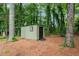 Backyard shed in a wooded, landscaped yard at 4158 Pepperdine Dr, Decatur, GA 30034