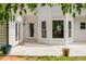 Spacious backyard showcasing a patio, well-maintained lawn, and white siding at 725 Eider Down Ct, Alpharetta, GA 30022