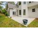 Backyard with white exterior, large windows, patio and ample yard space at 725 Eider Down Ct, Alpharetta, GA 30022