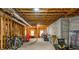 Unfinished basement space ready for customization, with exposed beams, concrete walls, and ample storage at 725 Eider Down Ct, Alpharetta, GA 30022