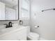 Well-maintained bathroom featuring a modern vanity, toilet, and shower with a patterned curtain at 725 Eider Down Ct, Alpharetta, GA 30022