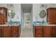 Bathroom showcasing double vanities with granite countertops and vessel sinks at 725 Eider Down Ct, Alpharetta, GA 30022