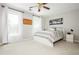 Bright bedroom with plush carpet, white platform bed, neutral decor, and two windows for ample natural light at 725 Eider Down Ct, Alpharetta, GA 30022