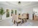 Bright dining area with neutral furnishings, large windows, and adjacent to the kitchen, perfect for Gathering meals at 725 Eider Down Ct, Alpharetta, GA 30022