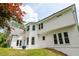 Back exterior featuring neutral paint, large windows and ample yard space at 725 Eider Down Ct, Alpharetta, GA 30022