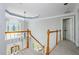 Hallway with stained glass window and decorative railing at 725 Eider Down Ct, Alpharetta, GA 30022