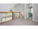 Upper hallway provides access to carpeted rooms at 725 Eider Down Ct, Alpharetta, GA 30022