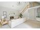 Bright living room boasts vaulted ceiling, fireplace, and staircase to the upper level at 725 Eider Down Ct, Alpharetta, GA 30022