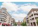 Charming street view showcasing the architectural diversity of the buildings and the vibrant atmosphere of the community at 725 Eider Down Ct, Alpharetta, GA 30022