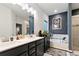 Bathroom featuring double vanity, soaking tub, and separate shower at 8268 E Carroll Rd, Whitesburg, GA 30185