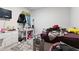 This bedroom features a TV, a desk, white walls, a window, and some furniture at 8268 E Carroll Rd, Whitesburg, GA 30185