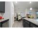 Open dining area with an adjacent kitchen offering a seamless transition and an ideal setup for gatherings at 8268 E Carroll Rd, Whitesburg, GA 30185