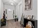 Inviting entryway with a modern front door, stylish decor, and attractive wood-look flooring at 8268 E Carroll Rd, Whitesburg, GA 30185