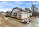 Side view of the beautiful home featuring a spacious two-car garage and brick and siding combination at 8268 E Carroll Rd, Whitesburg, GA 30185
