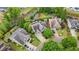 Aerial view of the neighborhood showcasing the home, backyard, and community pond at 2490 Hillandale Cir, Cumming, GA 30041