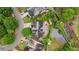 Aerial view of the home showcasing a lush backyard with water feature at 2490 Hillandale Cir, Cumming, GA 30041
