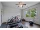 Bright home gym with exercise equipment, dark wood floors, and natural light from the double windows at 2490 Hillandale Cir, Cumming, GA 30041