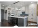 Open kitchen with a large island, bar stool seating, and view of the butler's pantry at 2490 Hillandale Cir, Cumming, GA 30041