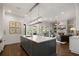 Bright, open kitchen features a spacious island with seating, flowing into the living area at 2490 Hillandale Cir, Cumming, GA 30041