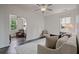 Cozy living room features ample seating, natural light, and access to other rooms at 2490 Hillandale Cir, Cumming, GA 30041