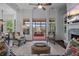 A modern living room featuring a fireplace, high ceilings, comfortable seating, and an open floor plan at 2490 Hillandale Cir, Cumming, GA 30041