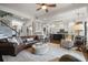 Spacious living area includes a large rug, comfortable seating, and open access to the kitchen at 2490 Hillandale Cir, Cumming, GA 30041