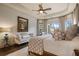 Spacious main bedroom with tray ceiling, sitting area, and natural light at 2490 Hillandale Cir, Cumming, GA 30041