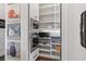 Walk-in pantry offers ample shelving and storage for kitchen essentials and snacks at 2490 Hillandale Cir, Cumming, GA 30041