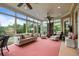 Bright sunroom with comfortable seating and views of the lush backyard garden at 2490 Hillandale Cir, Cumming, GA 30041