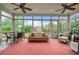 Inviting sunroom with large windows, comfortable seating, and views of the garden at 2490 Hillandale Cir, Cumming, GA 30041