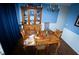 Cozy dining room featuring hardwood floors, a wooden table with chairs, and decorative accents at 4041 Smithfield Trl, Ellenwood, GA 30294