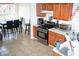 Well-lit kitchen featuring modern stainless steel appliances, tile floor, and a cozy breakfast nook at 4041 Smithfield Trl, Ellenwood, GA 30294