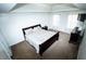 Spacious main bedroom featuring neutral carpet and a dark wood bedroom set with two windows offering natural light at 4041 Smithfield Trl, Ellenwood, GA 30294