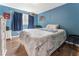 Bedroom features a full sized bed with hardwood floors and natural light from one window at 4070 Lauada Dr, Douglasville, GA 30135