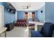 Comfortable blue bedroom featuring a bed, a futon, a TV, and a ceiling fan at 4070 Lauada Dr, Douglasville, GA 30135