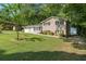 Two-story home with brick facade, attached garage, and a spacious front lawn at 4070 Lauada Dr, Douglasville, GA 30135