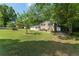 Two-story home with brick facade, attached garage, and a spacious front lawn at 4070 Lauada Dr, Douglasville, GA 30135