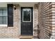 Close up of front door with black accents and brick siding at 4070 Lauada Dr, Douglasville, GA 30135