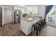 Modern kitchen with stainless steel appliances, granite countertops, and counter seating at 4070 Lauada Dr, Douglasville, GA 30135