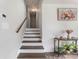 Hardwood stairwell with natural light and decorated landing at 4070 Lauada Dr, Douglasville, GA 30135