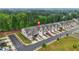 Aerial view of these townhomes with two car parking and mature trees at 241 Irwell Path, Lawrenceville, GA 30044