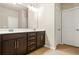 Bathroom featuring a double vanity with dark wood cabinetry and a white countertop at 241 Irwell Path, Lawrenceville, GA 30044