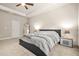 Comfortable bedroom featuring a bed, bedside table with lamps, and full-length mirror at 241 Irwell Path, Lawrenceville, GA 30044