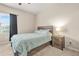 Comfortable bedroom featuring a cozy bed, nightstand, window, and natural light for a relaxing atmosphere at 241 Irwell Path, Lawrenceville, GA 30044