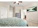Spacious bedroom with wood-framed bed, tv, dresser, and a en-suite bathroom for comfortable living at 241 Irwell Path, Lawrenceville, GA 30044