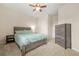 Serene bedroom with a wood-framed bed, dresser, and ample closet space, offering a comfortable retreat at 241 Irwell Path, Lawrenceville, GA 30044